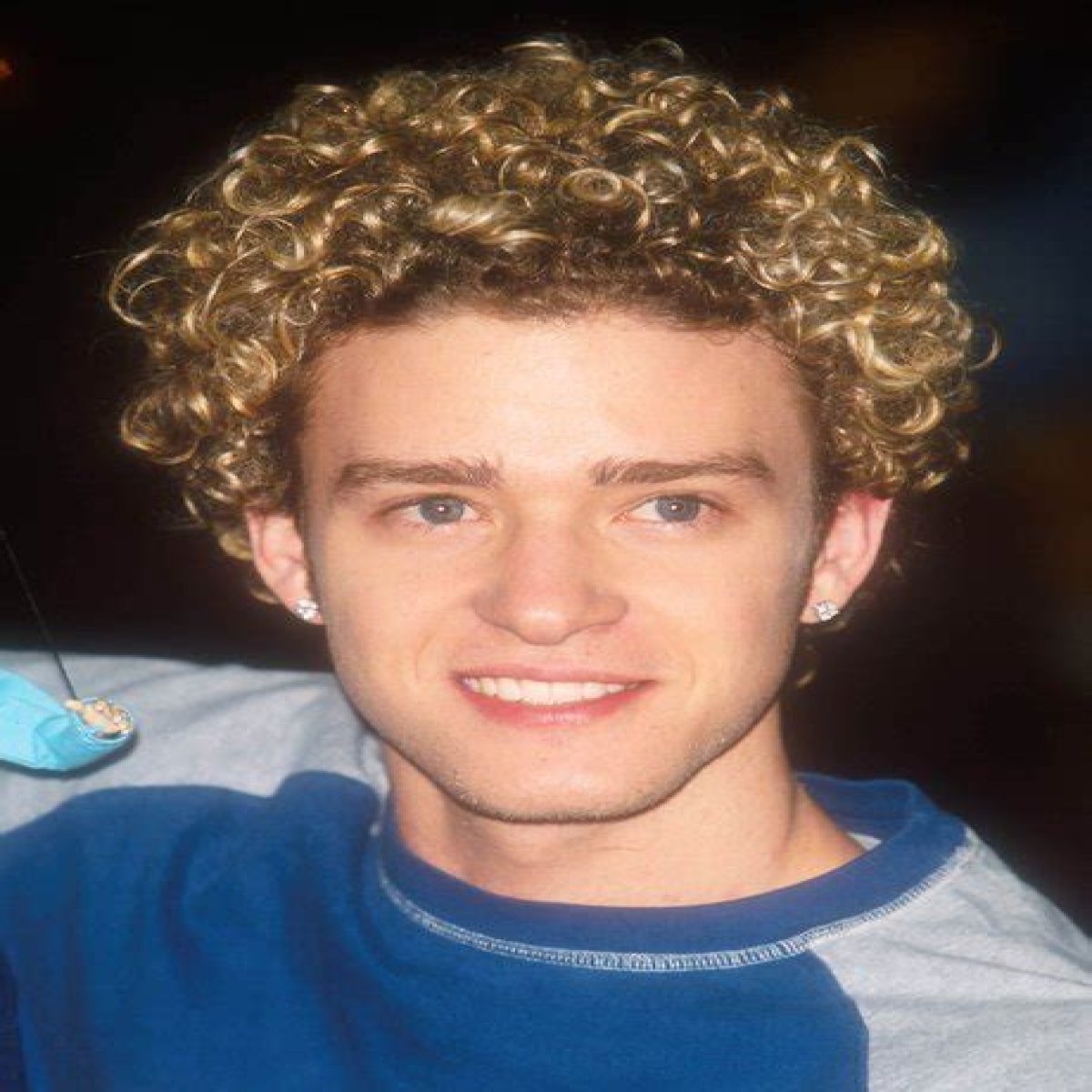 Justin Timberlake is growing out his boy band curly hair